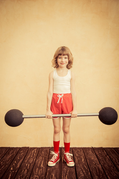 Strong child with barbell. - Fotó, kép