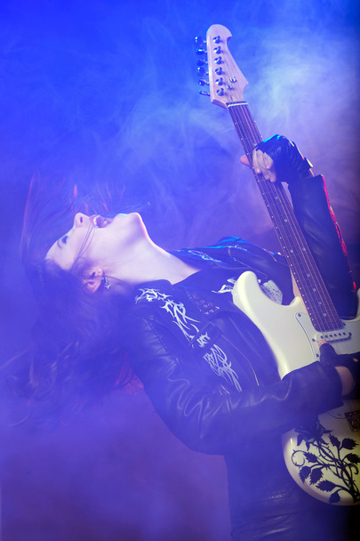 Young attractive rock girl playing the electric guitar - Foto, Imagem