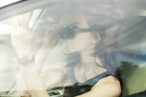 the girl in the car - Fotó, kép