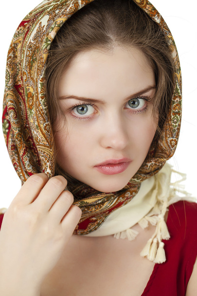 Young blonde woman in a red golden scarf  - Фото, изображение