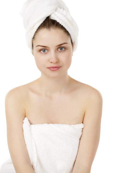 Beautiful young woman posing in white towel - 写真・画像