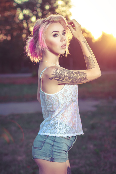 beautiful young girl with tattoos - Photo, Image