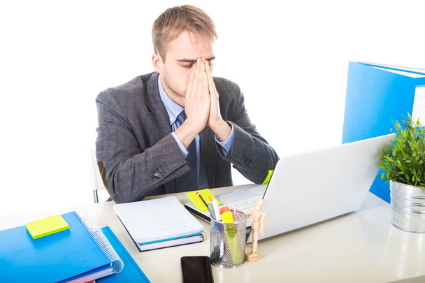 young overworked and overwhelmed businessman covering his face suffering stress and headache - Photo, Image