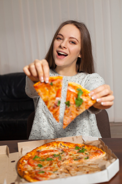 Woman with slices of pizza - Фото, изображение