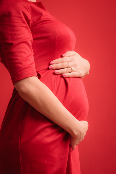 pregnant woman wearing dress - Фото, изображение