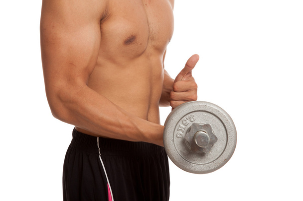 Muscular Asian man with dumbbell - Fotó, kép