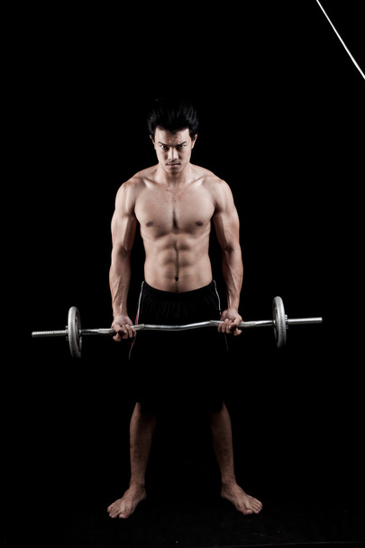Muscular Asian man  with barbell - Foto, imagen