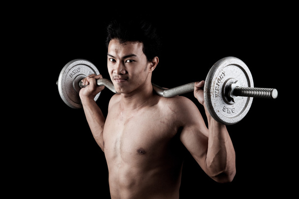 Muscular Asian man  with barbell - Fotoğraf, Görsel