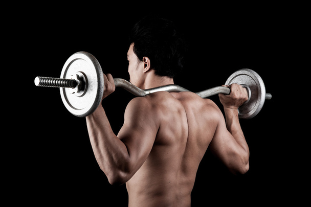 Muscular Asian man with barbell - Photo, Image