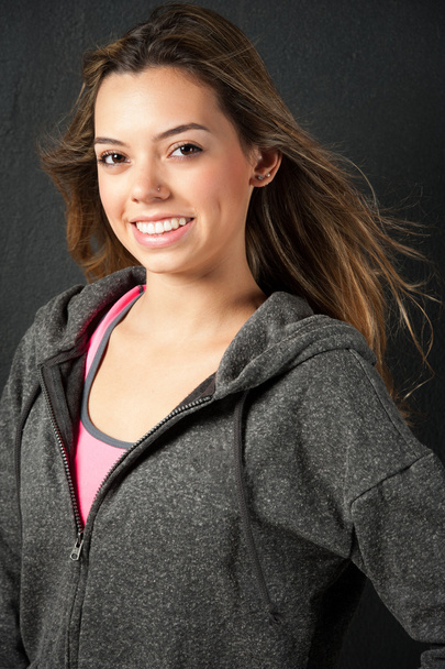 Attractive female fitness model isolated on a black background - Φωτογραφία, εικόνα