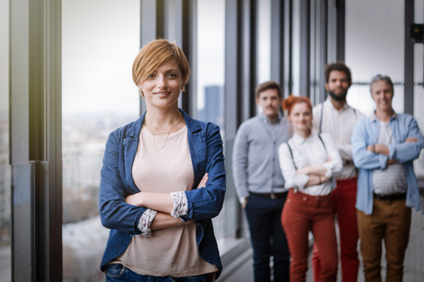 young business woman with her colleagues - Foto, afbeelding