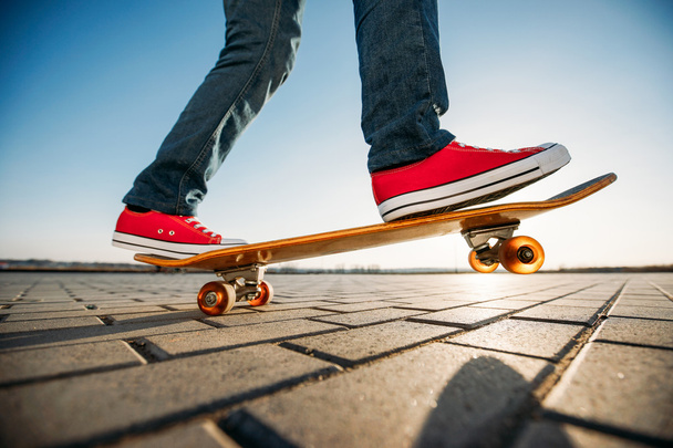 skater riding a skateboard. view of a person riding on his skate - Фото, изображение