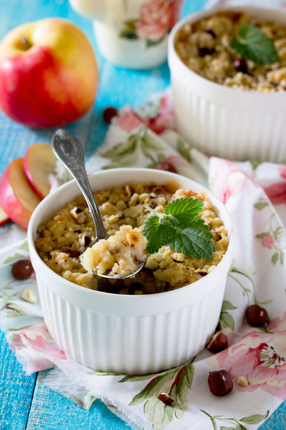 Dessert crumble with apple and nuts in a rustic style - Photo, Image