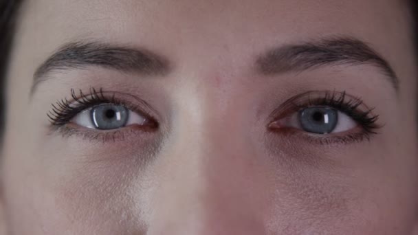eyes of a beautiful young woman  - Felvétel, videó