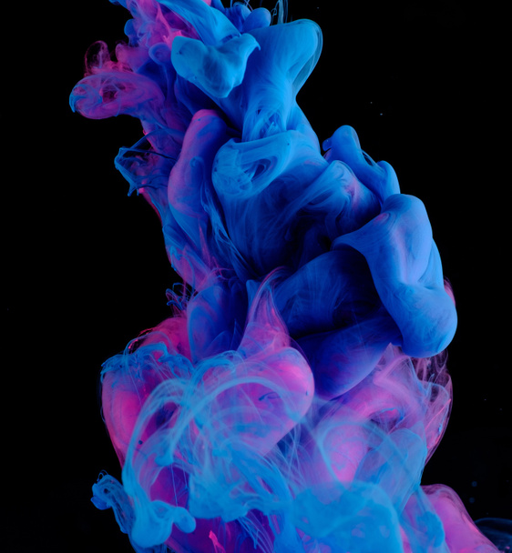 Blue pink clouds of ink in liquid isolated on black - Foto, Imagem