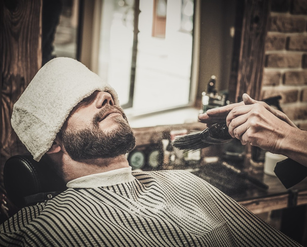 Client during beard and mustache grooming  - Photo, Image