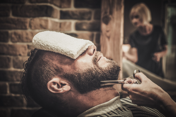 Client during beard and mustache grooming  - Photo, Image
