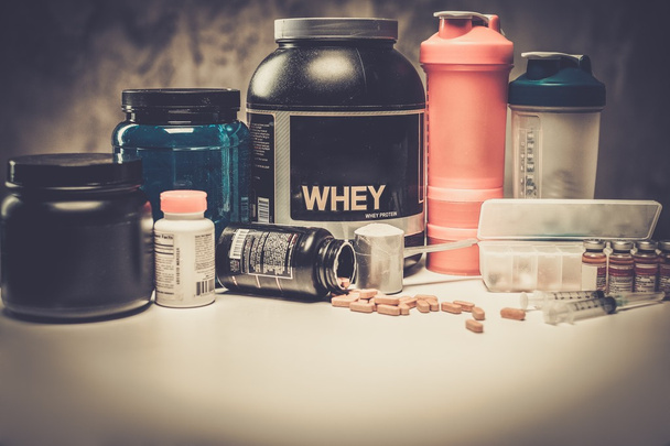 Bodybuilding nutrition supplements and chemistry  - Photo, Image