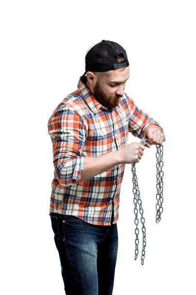 Man making streght against a chain. - Фото, зображення