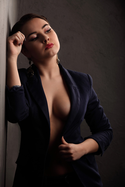 Beautiful girl with sexy breasts in jacket and beauty hair - Фото, зображення