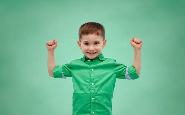 happy smiling little boy with raised hand - Фото, зображення