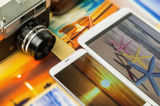 Old analog camera, smartphone and tablet, with colorful summertime pictures - Photo, Image