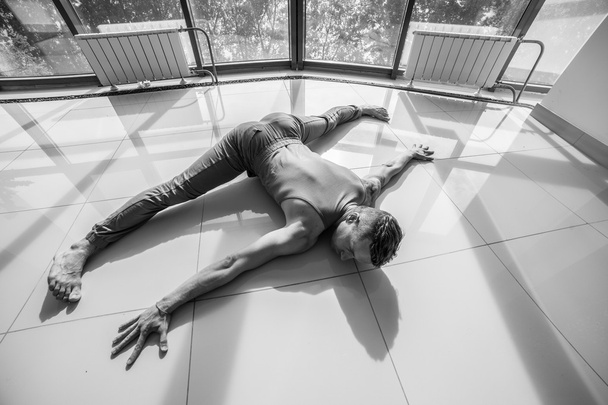 Athletic muscular young man working out, yoga - 写真・画像