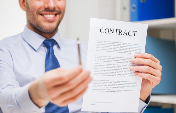 close up of businessman holding contract document - Fotó, kép