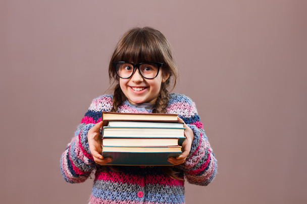 little school girl with books - 写真・画像