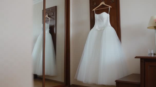 Fluffy wedding dress on a hanger - Footage, Video