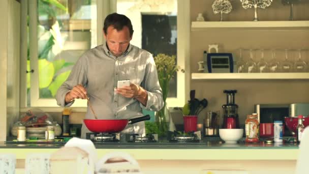 man taking photo of food during cooking meal - Felvétel, videó