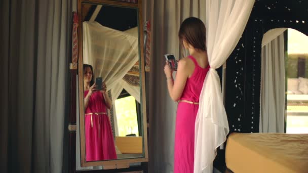 woman taking selfie photo in mirror - Video, Çekim
