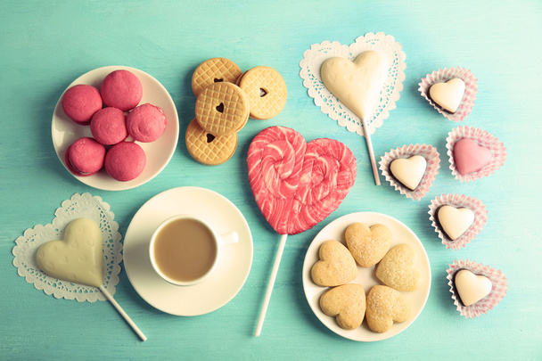 Valentine concept. Composition of cookies and candies on blue background - Foto, afbeelding