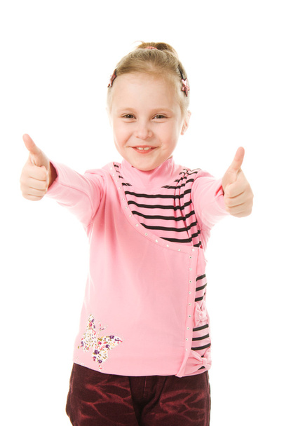 Smiling little girl with thumbs up sign - 写真・画像