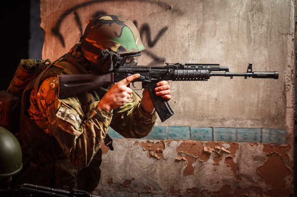 Soldier with the russian machine gun in abandoned building - Photo, Image