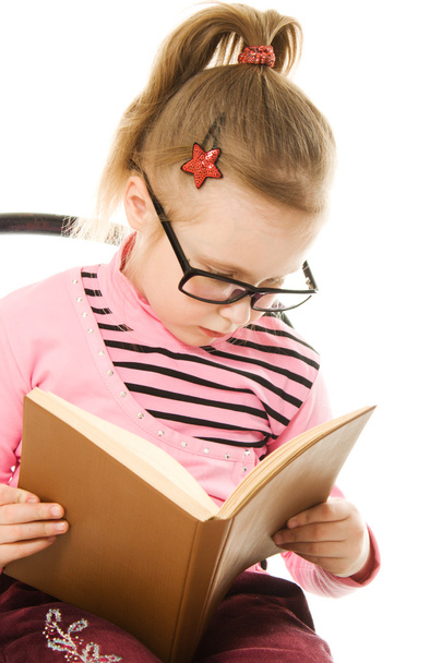 The little girl in glasses with a book - Foto, Bild