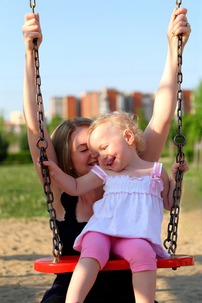 Mother and daughter in the park - Фото, зображення