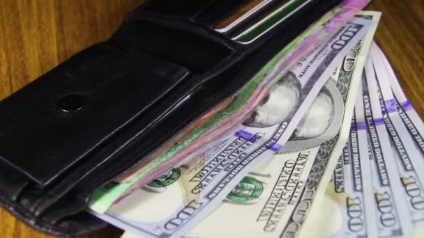 Money in a Wallet Rotating on a Wooden Table - Footage, Video
