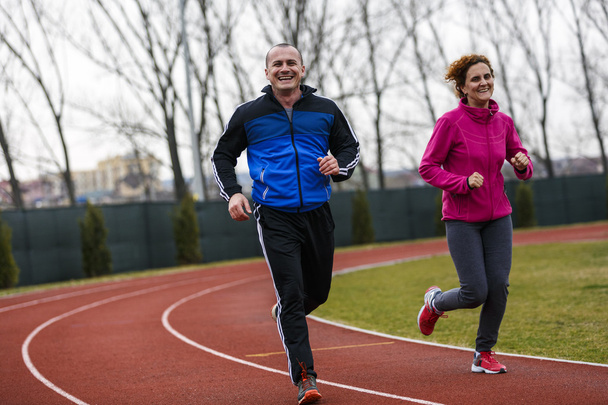 Couple marathon running for exercise and fitness training - Photo, Image