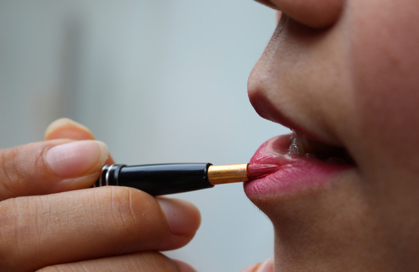 Close-up of a woman in red lipstick - Foto, Bild