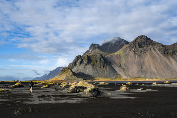 Mountains and volcanic lava sand in Stoksness, Iceland
 - Фото, изображение