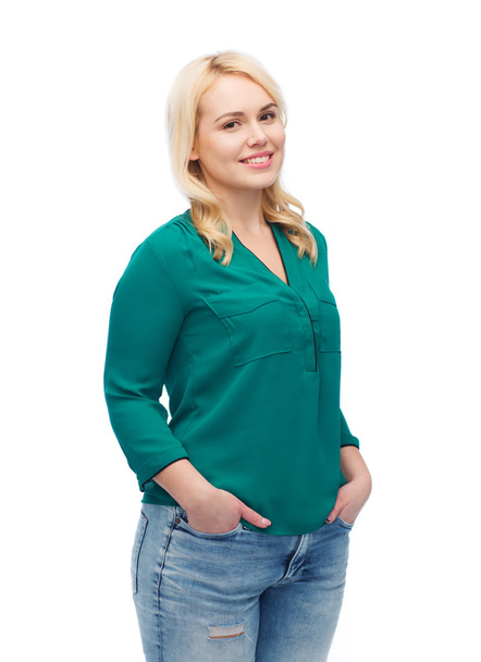 smiling young woman in shirt and jeans - Foto, afbeelding