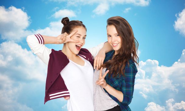 happy pretty teenage girls showing peace hand sign - Photo, Image