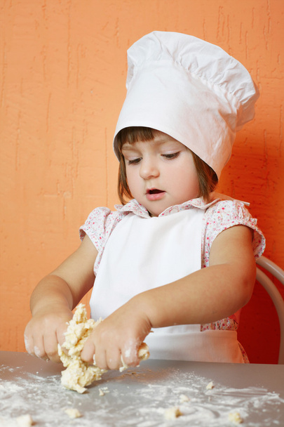 little cute chef cooking biscuits - Foto, Imagen