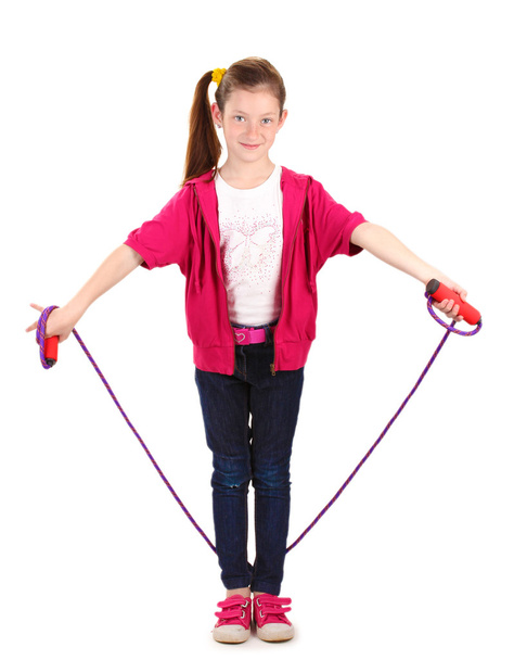 Beautiful little girl in sport clothes with skipping rope isolated on white - Foto, imagen