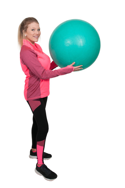 жінка з м'ячем для вправ
 - Фото, зображення