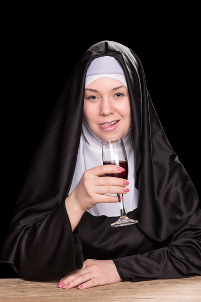 Funny nun with wine - Фото, изображение