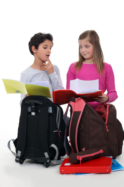 Schoolchildren comparing homework - Foto, Imagem