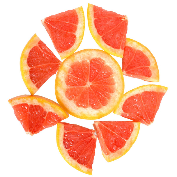 grapefruit cut in to slices close up top view - Fotó, kép