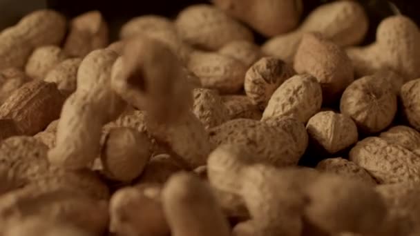peanuts falling in slow motion - Filmati, video